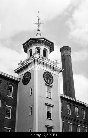 The clock tower at the Boott Cotton Mills Museum in historic Lowell, Massachusetts. Captured on analog black and white film. Lowell, Massachusetts. Stock Photo