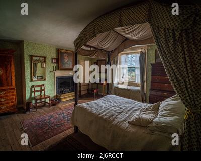 Modern image of a recreated master bedroom in a Georgian manor house with a four poster bed Stock Photo