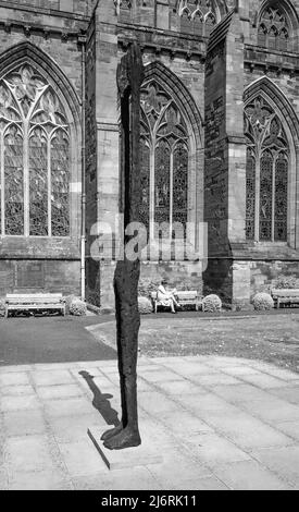 The rusting steel sculpture by John O' Connor sculpture Beyond Limitations, standing the grounds of outside Hereford Cathedral, Hereford, England, UK Stock Photo