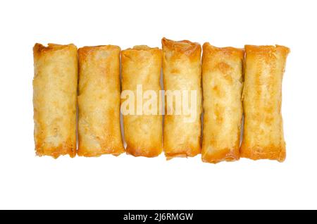 Group of mini spring rolls, ready to eat, in a row, from above. Small spring rolls, crispy baked in the oven. Filled and rolled wrappers. Stock Photo