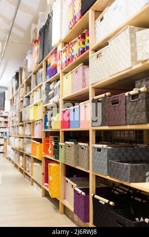 Storage boxes and baskets in home furnishings store Stock Photo