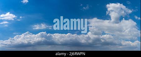 Panoramic photo of blue sky background with white clouds Stock Photo