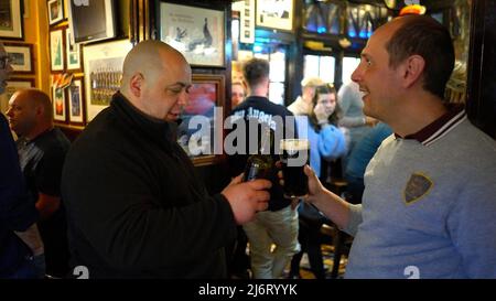 Guys in a pub drinking a beer Stock Photo