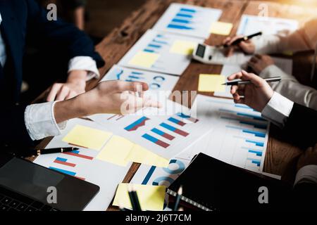 Team work process. young business managers crew working with new startup project. labtop on wood table, typing keyboard, texting message, analyze Stock Photo