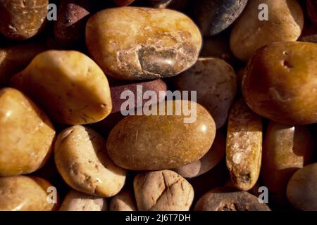 Close up texture photo of various configurations of small stones Stock Photo