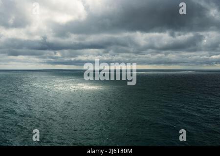 Dramatic dark clouds over the sea before the rain. background Stock Photo