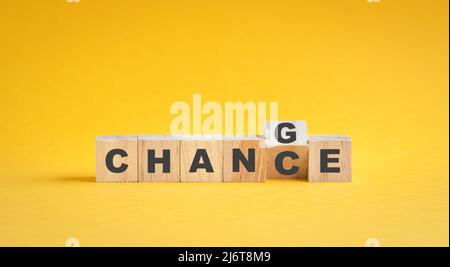 Wooden cube flip with word change to chance. Career growth and development concept. Stock Photo