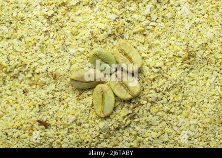 Ground green coffee and coffee beans. Top view. Stock Photo
