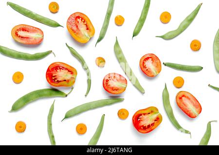 Creative layout made of haricot, tomatoes and carrot on white studio background wall. Flat lay, top view, copy space. Healthy, Shopping food supermark Stock Photo