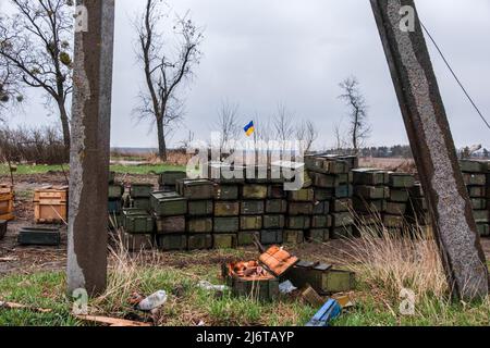 April 9, 2022, Makariv, Ukraine: Pile of empty Russian crates for ammunition in a field in Andrijvka village. Makariv is a town in the Bucha Raion, Kyiv Oblast, located 60 kilometers west of the capital city of Ukraine. For more than a month under Russian occupation, Makariv has no electricity, water, gas or telecommunication line. The Russian attacks destroyed forty percent of the area, and many mass killings are recorded. In addition, Russian troops destroyed infrastructures and mined some territories. (Credit Image: © Rick Mave/SOPA Images via ZUMA Press Wire) Stock Photo