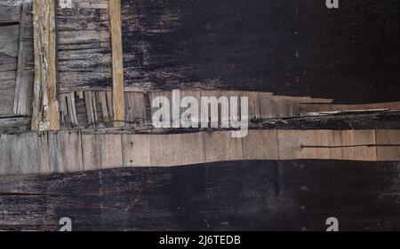 Close up peeling wood veneer door grunge background texture Stock Photo