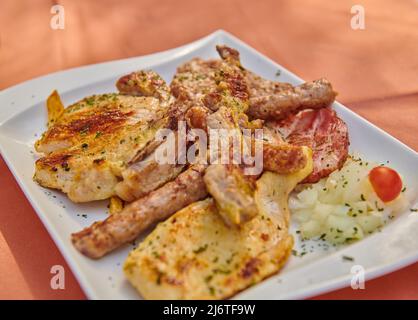assorted different types of meat on a plate Stock Photo