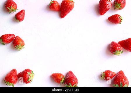 Fresh strawberries pattern on white background. Directly above. Copy space. Stock Photo
