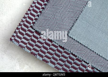 The background consists of several types of old colored tiles with different patterns on blue tone Stock Photo