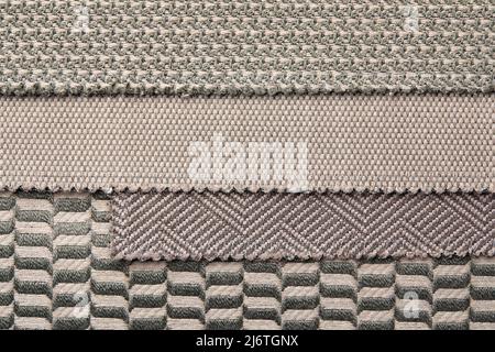 The background consists of several types of old colored tiles with different patterns on gray tone Stock Photo