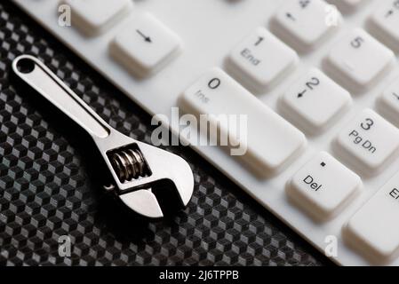 Electronic technical support concept. Wrenches Stock Photo
