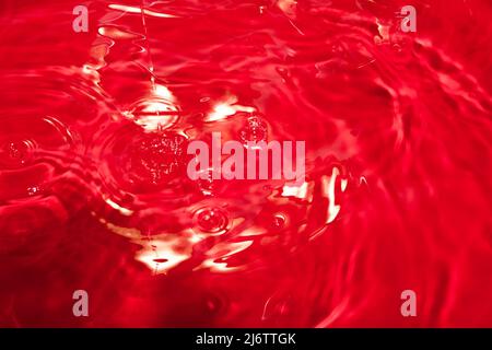 Red abstract chaotic backgroud with seamless pattern. Red liquid surface texture. Stock Photo