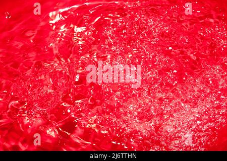 Red abstract chaotic backgroud with seamless pattern. Red liquid surface texture. Stock Photo