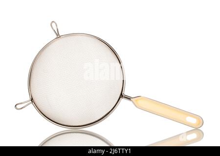 One metal sieve for the kitchen, close-up, isolated on a white background. Stock Photo