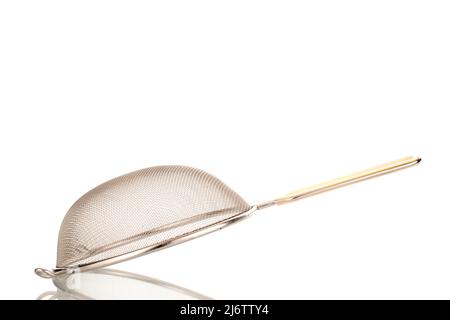 One metal sieve for the kitchen, close-up, isolated on a white background. Stock Photo