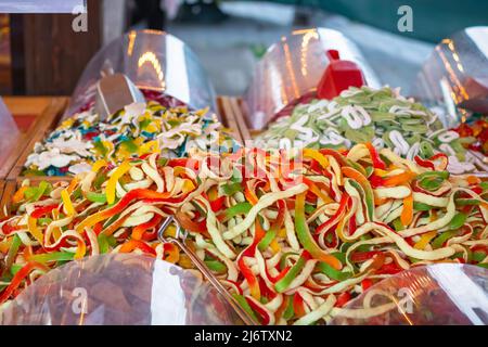 Giant snakes jelly and foam sweets on display at Christmas market Hyde Park Winter Wonderland in London Stock Photo