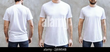 Young man with a beard in a blank white casual t-shirt and jeans. Front, close up and back view on light gray concrete wall. Design and layout of men's t-shirt for printing. Stock Photo