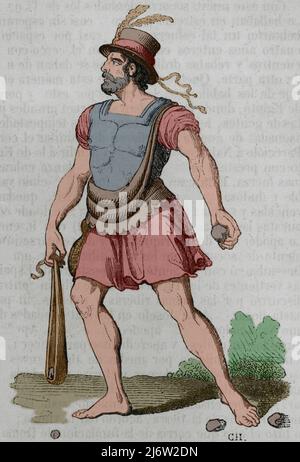 Ancient history. Balearic slingers. Mercenary warriors armed with slingshots in the service of the Roman and Carthaginian armies. Majorcan slinger. Engraving. Later colouration. Historia General de España by Father Mariana. Madrid, 1852.
