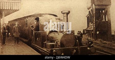 A Victorian photograph of a steam railway locomotive and staff on the London Millwall extension line, London. Stock Photo