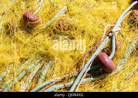 Yellow fishing nets and tackle in close-up Stock Photo