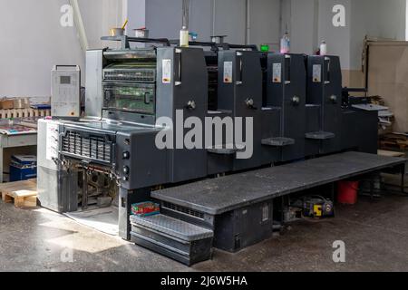 Printing Sheets Conveyor Wheels Machine Printer Production Equipment. Stock Photo