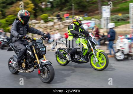 Small motorbikes ridden at speed at the Southend Shakedown 2022 motorcycle event on Easter Bank Holiday Monday in Southend on Sea, UK. Stock Photo