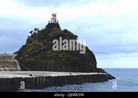 Old Lanyu lighthouse in Kaiyuan harbour, Lanyu island, Taiwan Stock Photo
