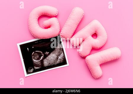 Ultrasound scan of unborn baby with letters girl Stock Photo