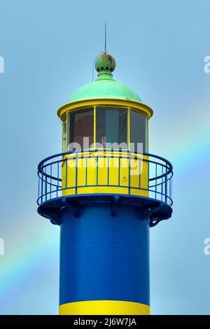 Lighthouse in the port city of Eckernförde, Schleswig-Holstein, in front of a rainbow in the sky Stock Photo