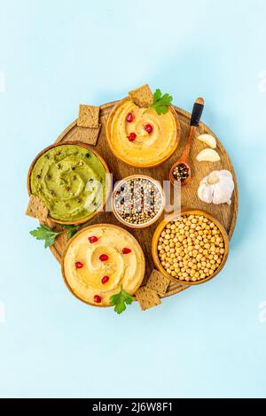 Hummus with snacks set - various types of hummus in bowls Stock Photo ...