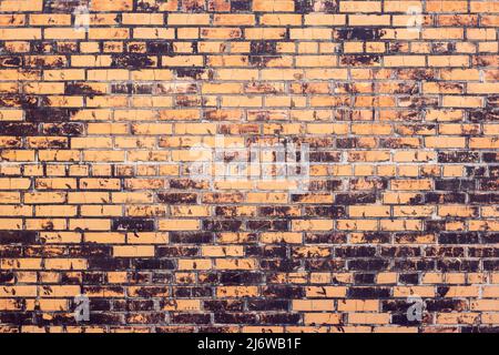 Old red and black brick wall from the time of the brick Stock Photo