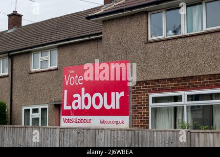 Slough, Berkshire, UK. 4th May, 2022. Boards outside residential homes promoting the Labour party in Slough. Following the handling of the Covid-19 crisis, the PPE scandal, Partygate and the cost of living crisis, the Tory party are predicted to lose hundreds of seats in the local elections tomorrow. Credit: Maureen McLean/Alamy Live News Stock Photo