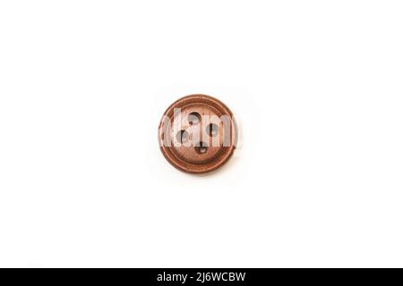Brown sewing button on a white background with copy space Stock Photo