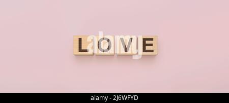 Wooden cubes with word Love on pink background. love letters on wood block for your girlfriend, boyfriend, for Valentines Day greeting romantic postca Stock Photo