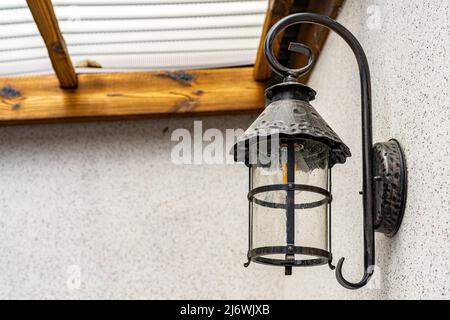 Lamp in vintage style. The lamp is attached to the wall. The lamp is black Stock Photo