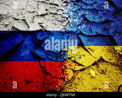 Russia vs Ukraine national flags pattern on grungy dry cracking earth, military conflict in Ukraine concept Stock Photo