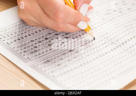 Close up of hands of student doing test. Stock Photo