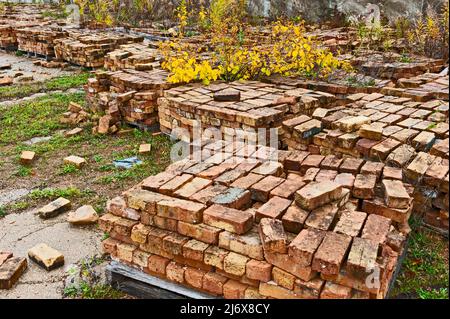 Stacks of old bricks for sale at site of abandoned old factory in Ludington, Michigan, USA. Stock Photo