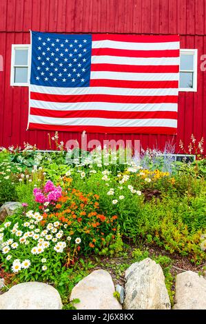 American flag posted on the side of a red barn near Ludington, Michigan, USA Stock Photo