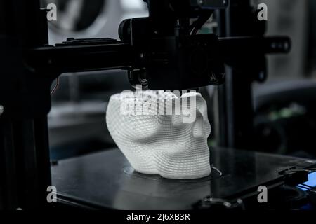 The 3D printer prints white plastic model Stock Photo