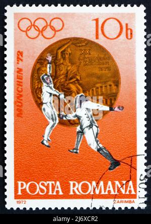 ROMANIA - CIRCA 1972: a stamp printed in the Romania shows Fencing, Bronze Medal at 20th Olympic Games, Munich, circa 1972 Stock Photo