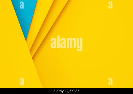 Abstract colored papers geometry flat lay composition background with blue and yellow colors Stock Photo