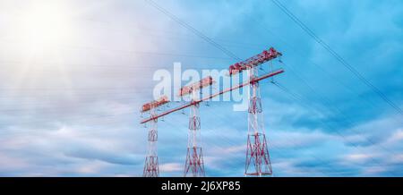 High-voltage transmission towers. High voltage post. High voltage tower sky sunset background Stock Photo