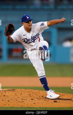 Starting pitcher Julio Urias #7 of the Los Angeles Dodgers warms up in the  bullpen prior to a baseball game between the Los Angeles Dodgers…