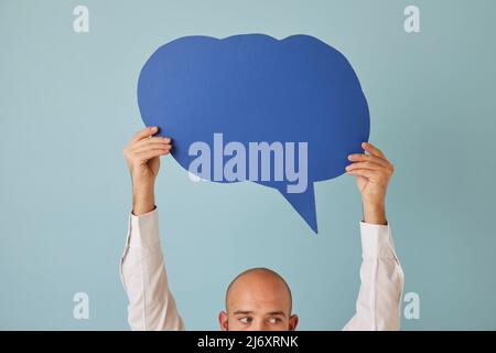 Man hold speech bubble show good deal Stock Photo